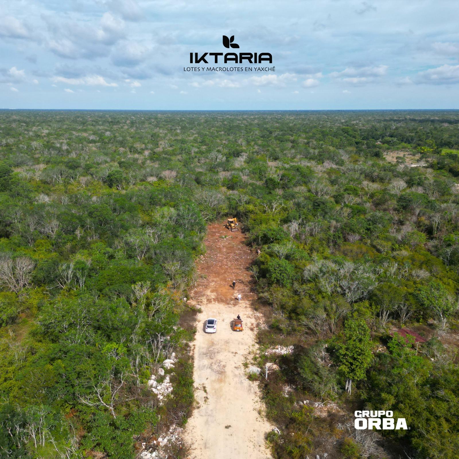 Architectural render of a modern residential development with green areas.